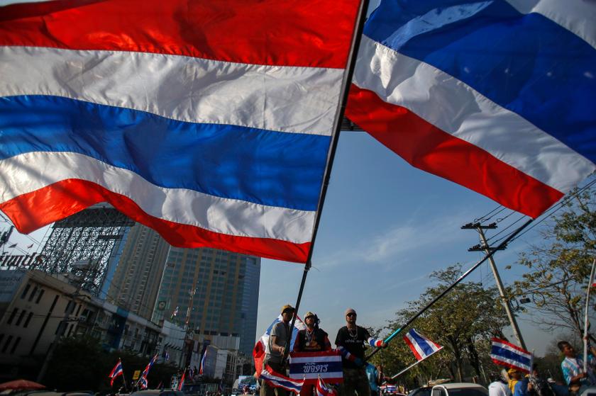 Anti-government protesters wave Thai national flags before marching towards the Public Health Ministry in Bangkok January 16, 2014. u00e2u20acu201d Reuters pic