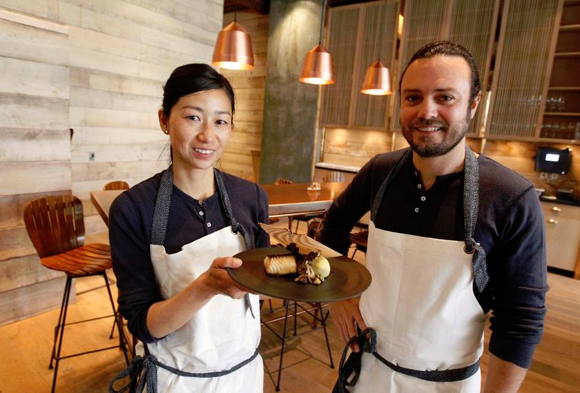 Chef and owner of the restaurant Hinoki & the Bird David Myers (right) poses with chef Kuniko Yagi in the restaurant with one of their signature dishes, hinoki scented black cod, sweet potatoes and pistachios in Los Angeles April 19, 2013. — Reuters pic