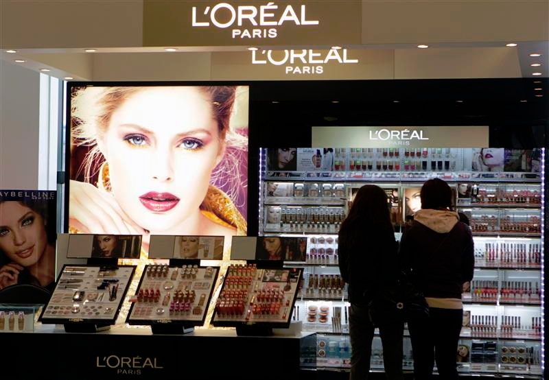 People look at L'Oreal cosmetics in a shop in Riga April 13, 2012. u00e2u20acu201d Reuters pic