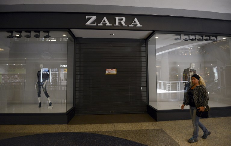 The closed entrance of a branch of the Spanish chain store Zara in a shopping center in Caracas, on February 25, 2013. - AFP pic