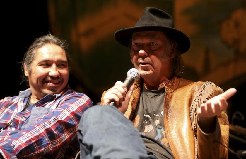 Musician Neil Young addresses the media as Athabasca Chipewyan First Nation Chief Allan Adam (left) looks on before the u00e2u20acu02dcHonor The Treatiesu00e2u20acu2122 concert series at the Centennial Concert Hall in Winnipeg, Manitoba, January 17, 2014. u00e2u20acu201d Reuters pic
