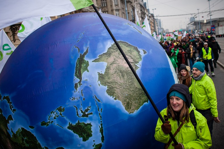 Enviromental activists march demanding more climate saving actions during the United Nations Climate Change COP19 conference on November 16, 2013. u00e2u20acu201d AFP pic