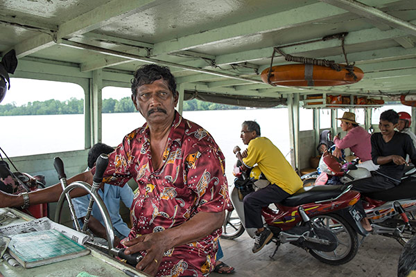 Sungai Bernam ferry pilot, Sreeraman a/l Chimachalam, always puts his passengers’ safety first. – Picture courtesy of Kenny Loh