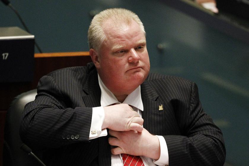 Toronto Mayor Rob Ford adjusts his tie during a special council meeting at City Hall in Toronto November 18, 2013. u00e2u20acu201d Reuters pic