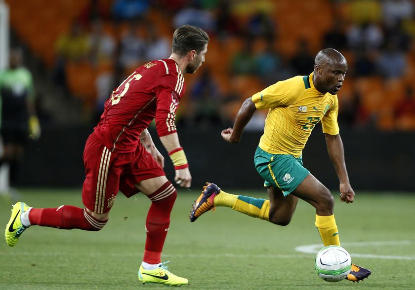 Spain's Sergio Ramos (left) challenges South Africa's Tokelo Rantie during their international friendly football match at Soccer City in Johannesburg November 19, 2013. u00e2u20acu201d Reuters pic