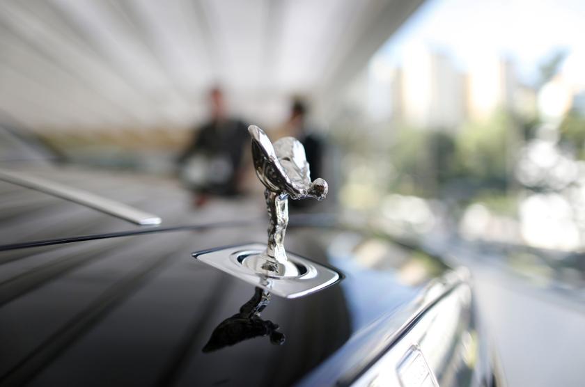 A Rolls-Royce mascot known as the u00e2u20acu02dcSpirit of Ecstasyu00e2u20acu2122 stands on the front of a Rolls-Royce Ghost in a showroom in Singapore October 8, 2013. u00e2u20acu201d Reuters pic