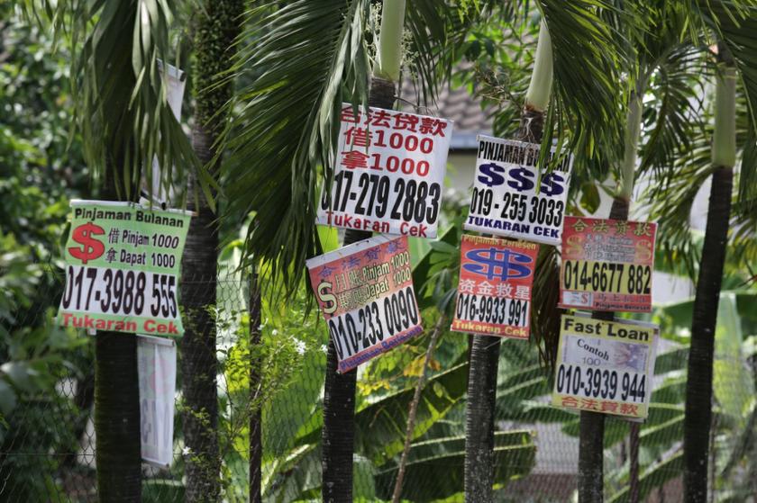 Generic ah long banners. u00e2u20acu201d Picture by Saw Siow Feng