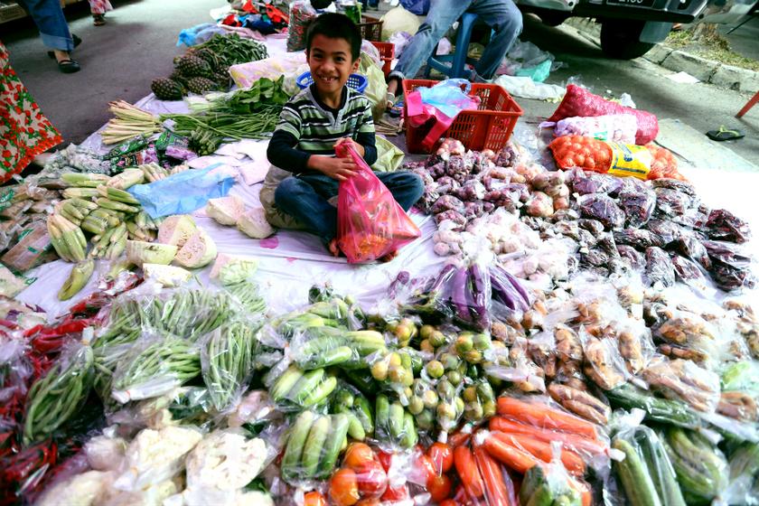 People buy new cloth, scarf, and food for Hari Raya at Pasar Tani Kuala Besut, July 16, 2013. u00e2u20acu201d Picture by Saw Siow Feng