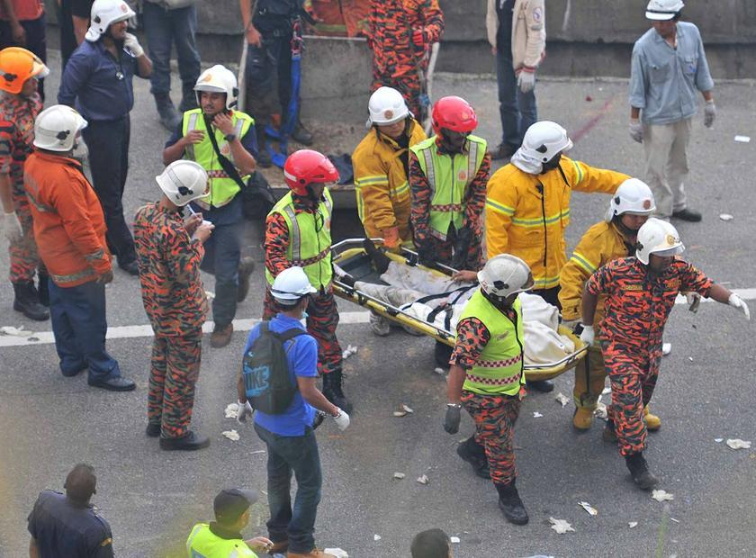 Rescuers have so far pulled out 16 people and one body from the wreckage. — Picture by Siow Feng Saw