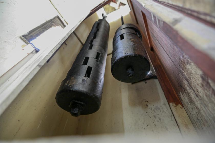 The 14 bars of weights for the bell on the left weighs 200kg, while the five bars on the right for the clock, weigh 50kg.