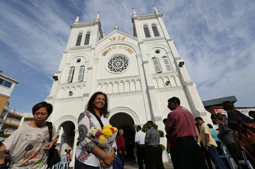 Datin Paduka Marina Mahathir stands outside the Church of Our Lady of Lourdes in Klang, Selangor, January 5, 2014. u00e2u20acu201d Picture by Saw Siow Feng