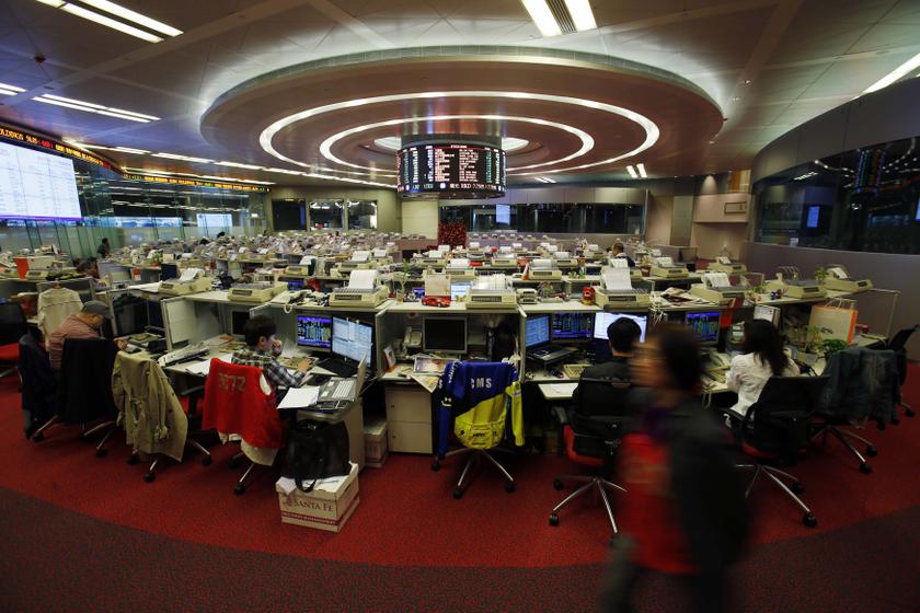 Floor traders monitor share prices during morning trading at the Hong Kong Stock Exchange in Hong Kong. u00e2u20acu201d Reuters pic