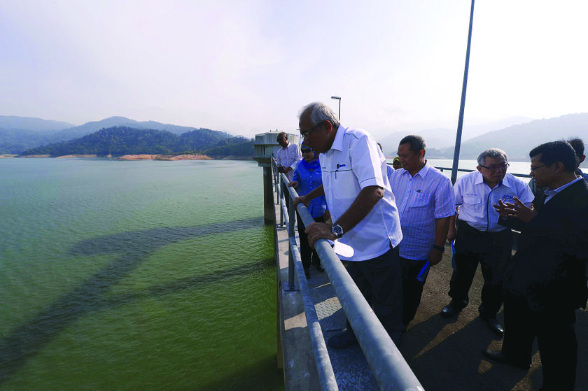 Running low: Mahdzir looks at the level of water at the Sungai Selangor Dam which is left with 57.6 per cent of water.