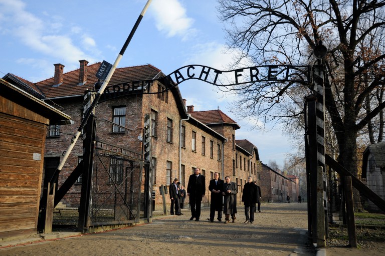 UN Secretary-General Ban Ki-moon (2nd left) visits a former Auschwitz concentration camp on November 18, 2013 in Oswiecim, Poland. Germany has arrested 3 suspected former SS guards. u00e2u20acu201d AFP pic