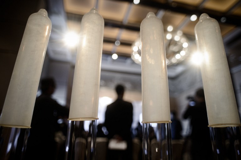 Samples of the world's thinnest latex condom are displayed during a press conference in Hong Kong on February 20, 2014. u00e2u20acu201d AFP pic