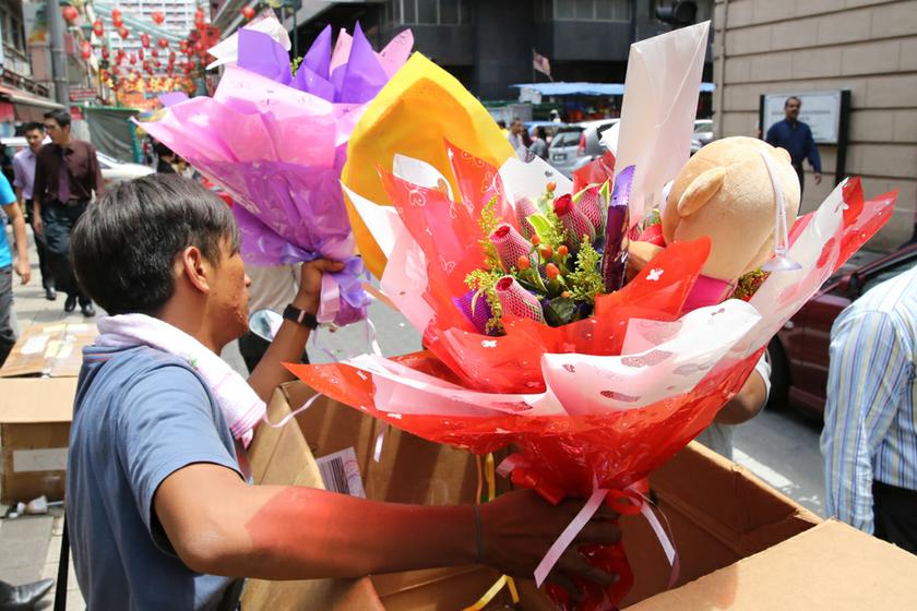 Petaling Street Florist offers flower delivery service, on February 14, 2014. u00e2u20acu201d Picture by Saw Siow Feng