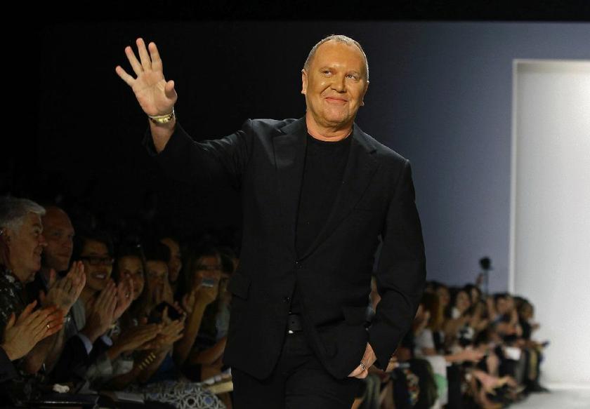Designer Michael Kors acknowledges the crowd after his Spring/Summer 2014 collection show during New York Fashion Week in this file photo taken September 11, 2013 Reuters