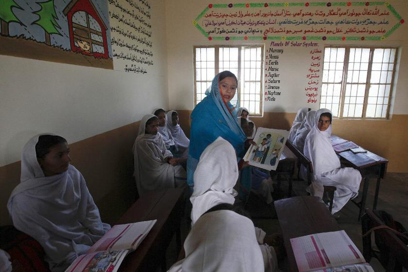 A teacher shows a flash card depicting a student molested by a teacher, at class in Shadabad Girls Elementary School in Gohram Panhwar village in Johi, some 325 km from Karachi February 12, 2014 Reuters