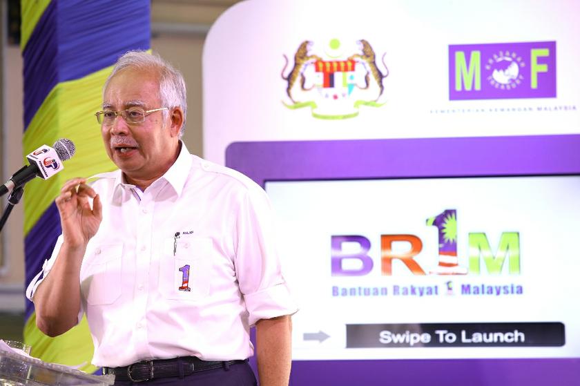 Prime Minister Datuk Seri Najib Tun Razak launches the national-level 1Malaysia People's Aid (BR1M) 2014 at SMK Aminuddin Baki, Kampung Pandan, Kuala Lumpur February 22, 2014. u00e2u20acu201d Picture by Saw Siow Feng