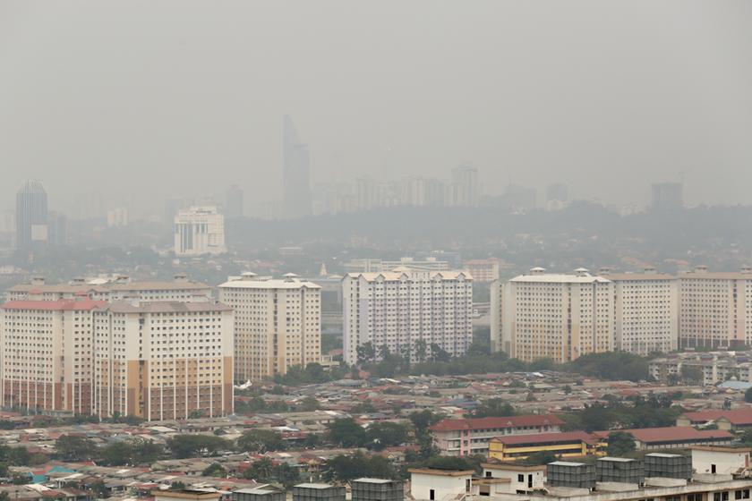 A view of the Kuala Lumpur-Petaling Jaya skyline and the Telekom Malaysia building shrouded in haze, taken from Bandar Puchong on February 25, 2014. u00e2u20acu201d Picture by Saw Siow Feng