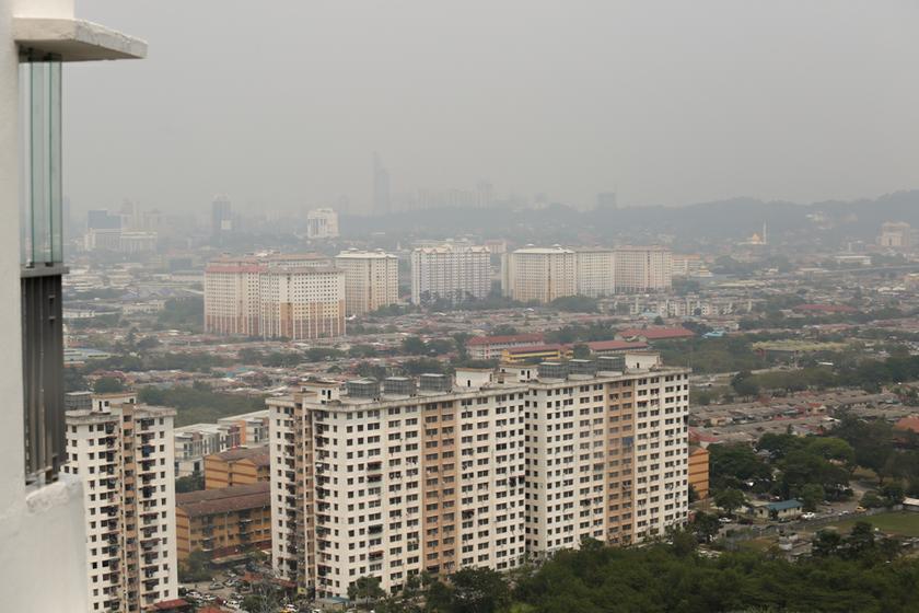 A view of the Kuala Lumpur-Petaling Jaya skyline and the Telekom Malaysia building shrouded in haze, taken from Bandar Puchong on February 25, 2014. u00e2u20acu201d Picture by Saw Siow Feng