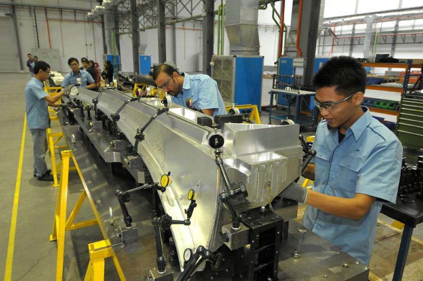 Workers making aircraft beams at the Aviatron facility in Bukit Minyak, Penang.