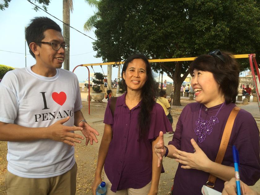 From left: Azrul, Aida and Jenny led more than 50 Malaysians in the A Walk in The Park that led through the heritage trail to stop at four places of worship in George Town.