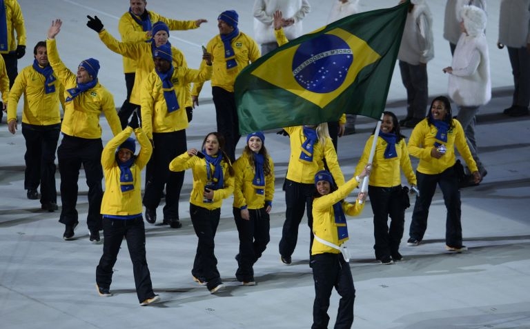 Brazil's flag bearer, biathlete Jaqueline Mourao, leads her delegation during the Opening Ceremony of the Sochi Winter Olympics at the Fisht Olympic Stadium on February 7, 2014 in Sochi. u00e2u20acu201d AFP pic
