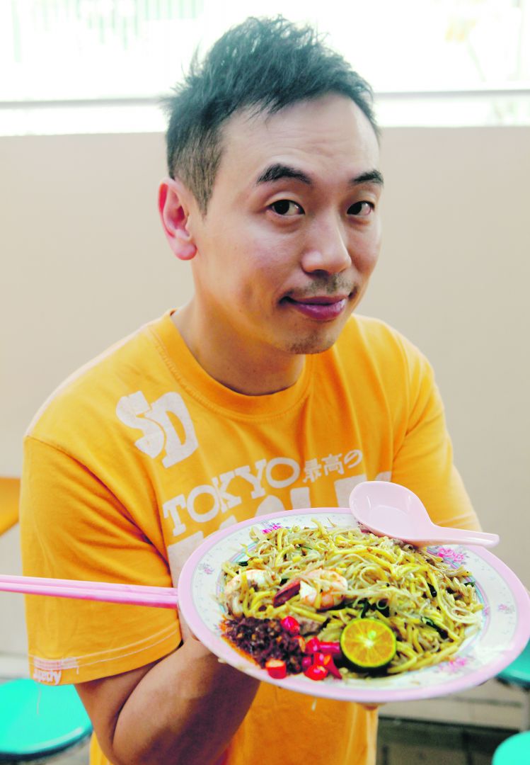 Chef Willin Low in Hokkien mee heaven at Golden Mile Food Centre. u00e2u20acu2022 Today pic