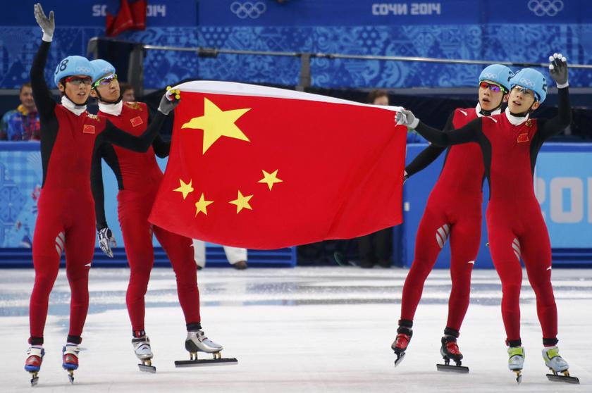Members of the third-place China team celelebtate with their country's flag after the men's 5,000 metres relay short track speed skating final event at the Iceberg Skating Palace during the 2014 Sochi Winter Olympics February 21, 2014. u00e2u20acu201d Reuters pic