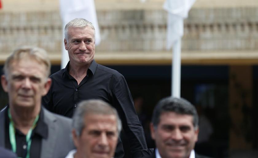 France's coach Didier Deschamps (second left, back) arrives to an official photo at the Team Workshop for the 2014 World Cup, in Florianopolis in Santa Catarina state February 19, 2014. u00e2u20acu201d Reuters pic