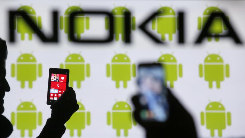 Men holding Nokia Lumia 820 phones are silhouetted against a backdrop of a Nokia logo and Android logos in the central Bosnian town of Zenica in this photo illustration taken February 25, 2014. u00e2u20acu201d Reuters pic
