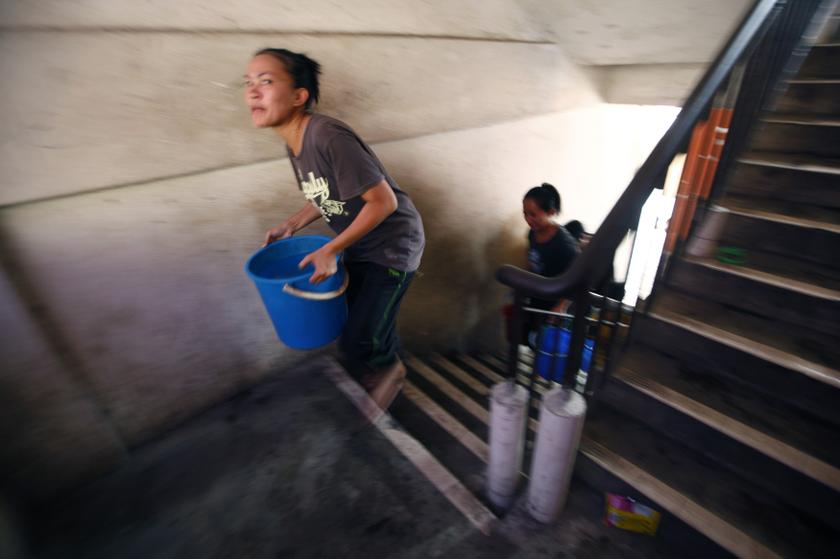 Residents carry pails of water at Taman Setia Balakong, outside Kuala Lumpur, February 25, 2014. u00e2u20acu201d Reuters pic
