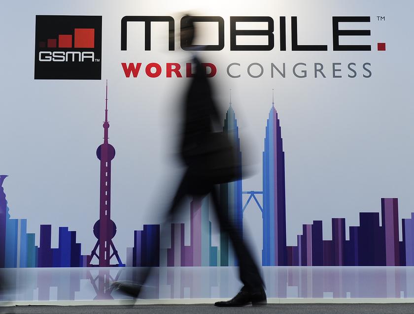 A visitor walks past a board of the 2013 Mobile World congress on the second day of the congress in Barcelona on February 25, 2013.  u00e2u20acu201d AFP pic