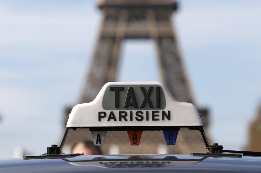 Taxi drivers on strike stand near the Eiffel tower as they protest in Paris February 10, 2014.u00c2u00a0u00e2u20acu201d Reuters pic