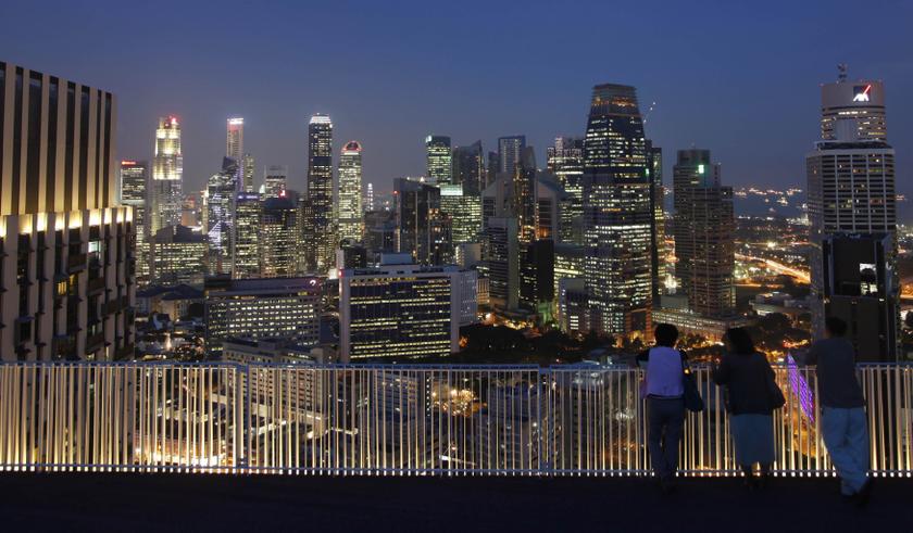 People look at the skyline of the central business district from the Skybridge of The Pinnacles at Duxton public housing estate in Singapore April 25, 2013. u00e2u20acu2022 Reuters pic