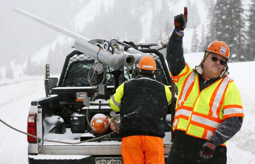 Colorado Department of Transportation equipment manager Jack Stieber signals for another shell to be brought up to the truck-mounted Avalauncher on Vail Pass to trigger an avalanche on I-70 near Vail, Colorado, February 13, 2014. u00e2u20acu201d Reuters pic