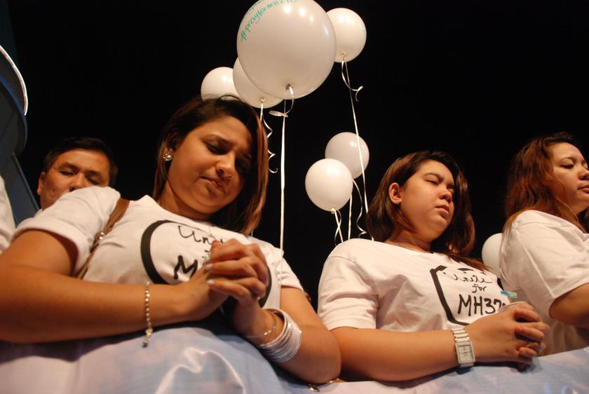 Women pray during a special event for the passengers of the missing Malaysia Airlines MH370 at The Curve, Petaling Jaya March 18, 2014. u00e2u20acu201d Picture by Yusof Mat Isa