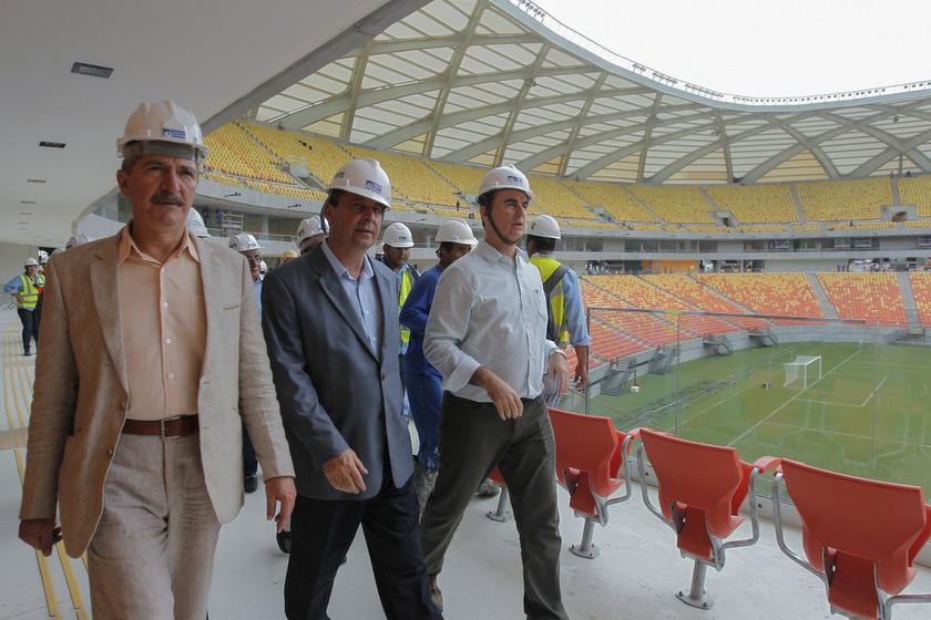 Brazil's Sports Minister Aldo Rebelo (left) and Governor of Amazonas state, Omar Aziz (centre), inspect the Arena Amazonia stadium that will host matches in the first round of the 2014 World Cup, in Manaus February 12, 2014.  u00e2u20acu201d Reuters pic