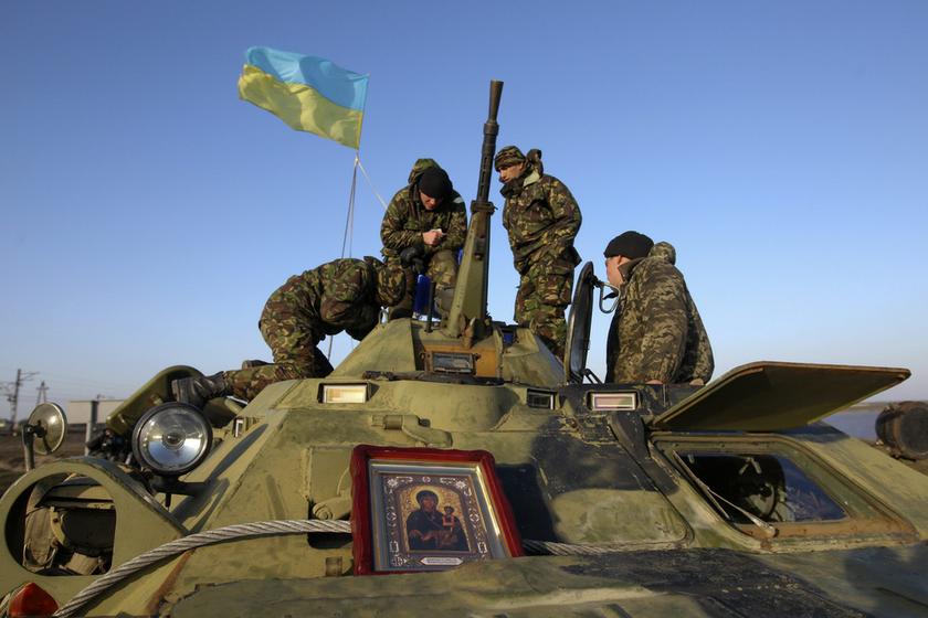 Ukrainian soldiers stand on top of an armoured personnel carrier at a checkpoint near the village of Salkovo, near a Crimea region border March 10, 2014. u00e2u20acu201d Reuters pic
