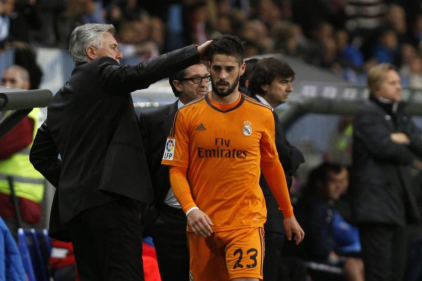 Real Madrid's Isco is congratulated by his coach Carlo Ancelotti after he was substituted during their Spanish First Division football match against Malaga at La Rosaleda stadium in Malaga March 15, 2014. u00e2u20acu201d Reuters pic