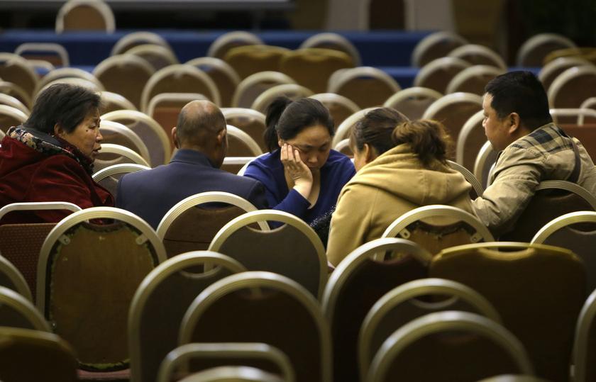Relatives of passengers aboard Malaysia Airlines flight MH370 chat after a meeting with representatives from the airline at Lido Hotel in Beijing, March 16, 2014. u00e2u20acu201d Reuters pic