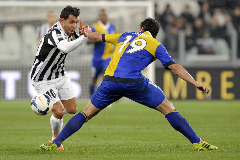 Juventus' Carlos Tevez (left) fights for the ball with Parma's Felipe during their Italian Serie A football match at Juventus Stadium in Turin March 26, 2014. u00e2u20acu201d Reuters pic