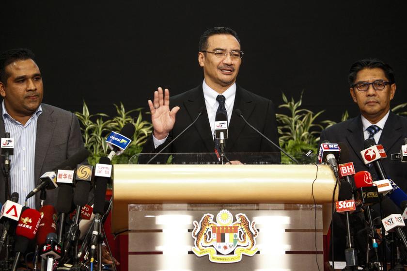 Malaysia's acting Transport Minister Hishammuddin Hussein (centre) gestures as he speaks about the search for the missing Malaysia Airlines Flight MH370, during a news conference at Putra World Trade Center in Kuala Lumpur March 26, 2014. u00e2u20acu201d Reuters pic