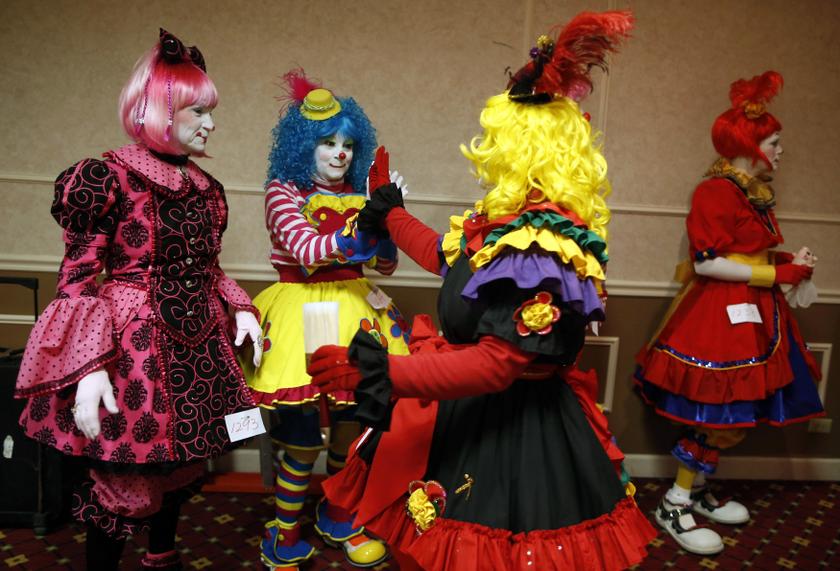 Clowns congratulate each other during the makeup competition at the World Clown Associationu00e2u20acu2122s annual convention in Northbrook, Illinois, March 30, 2014. u00e2u20acu2022 Reuters pic