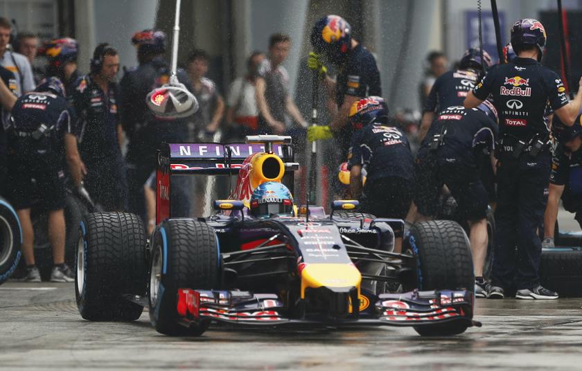 Red Bull Formula One driver Sebastian Vettel of Germany leaves his team garage during the qualifying session for the Malaysian F1 Grand Prix at Sepang International Circuit outside Kuala Lumpur, March 29, 2014. u00e2u20acu2022 Reuters pic