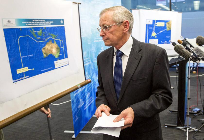 John Young, general manager of the emergency response division of the Australian Maritime Safety Authority (AMSA) walks past a diagram showing the search area for Malaysia Airlines Flight MH370 in the Indian Ocean, March 20, 2014. u00e2u20acu201d Reuters pic
