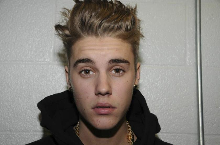 Canadian pop singer Justin Bieber booed by the crowd at a basketball game recently. ― Reuters pic