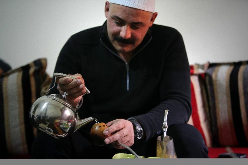 A Lebanese Druze prepares mate, an infusion of Ilex paraguayensis drunk hot on a gourd through a metallic tube AFP