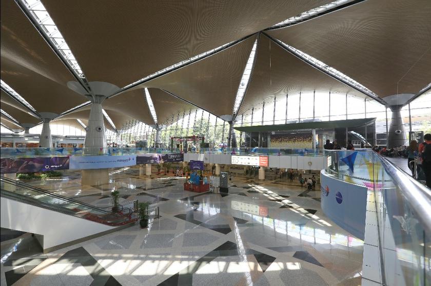 Only a handful of passengers are at the immigration counters at the KLIA departure hall in Sepang march 17,2014.  u00e2u20acu201d Picture by Saw Siow Feng